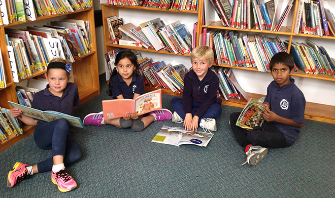children sitting in the library